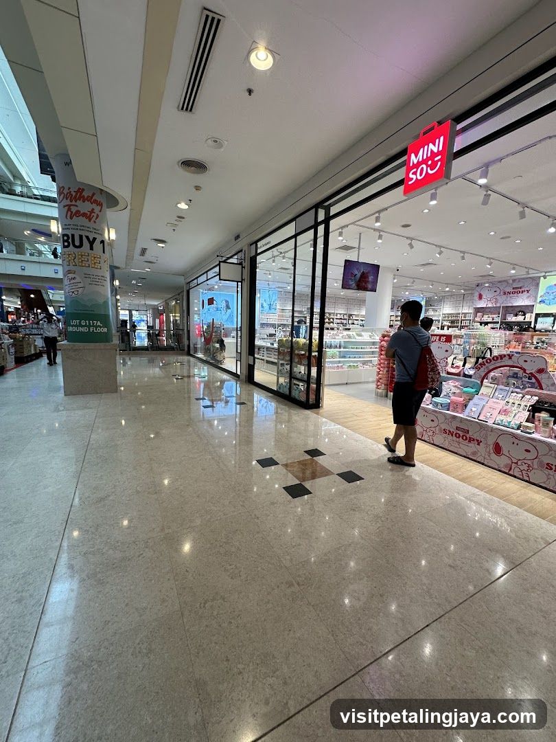 Shopping Mall Interior with Storefronts and Displays