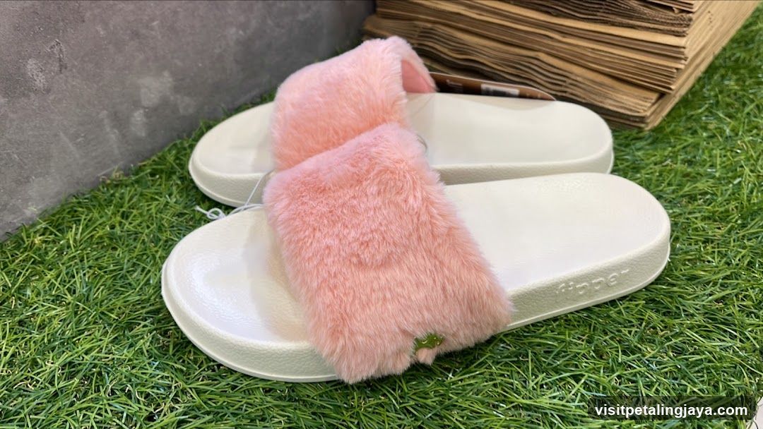 Pink Fuzzy Slippers on Artificial Grass