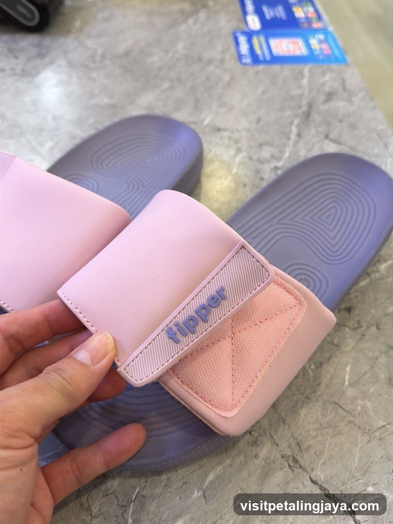 Pink Flipper Slides on Marble Floor