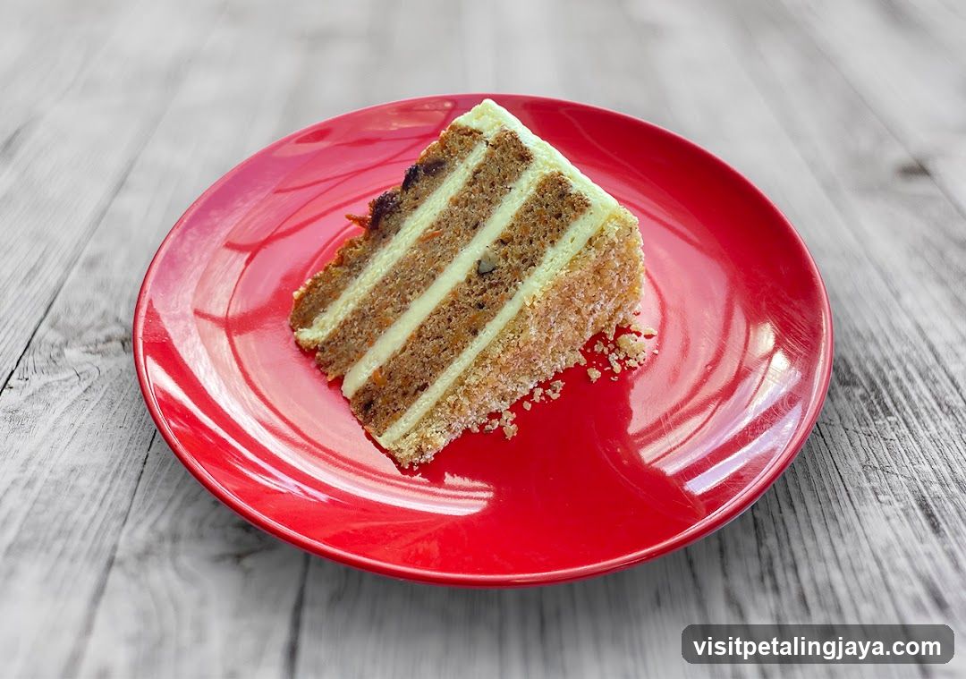 Slice of Layered Cake on Red Plate