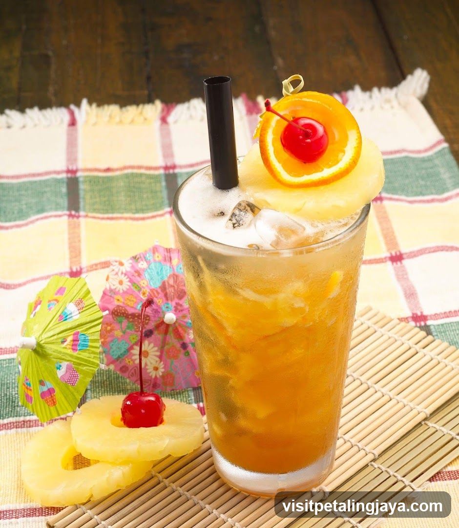 Tropical Iced Drink with Pineapple and Cherry Garnish