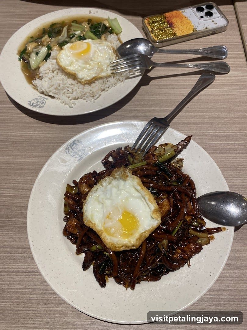 Food on table with fried egg and stir-fry