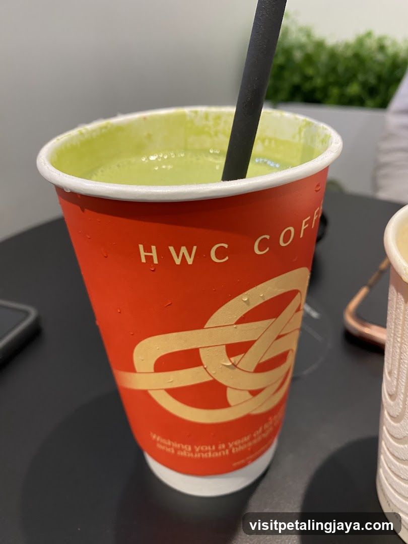 HWC Coffee Cup with Green Drink