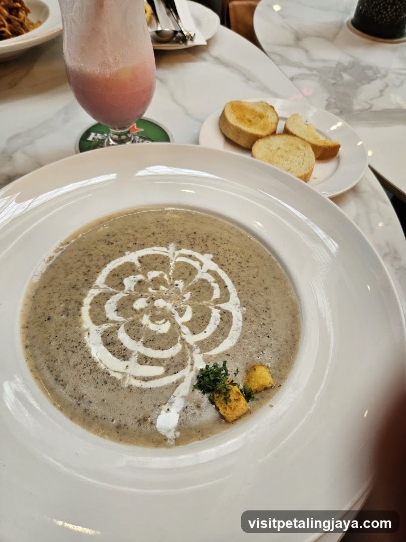 Soup with garnish and bread