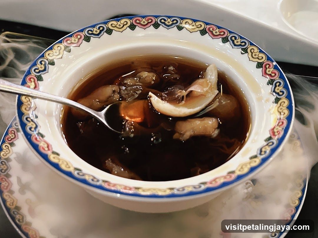 Bowl of Dark Broth with Seafood
