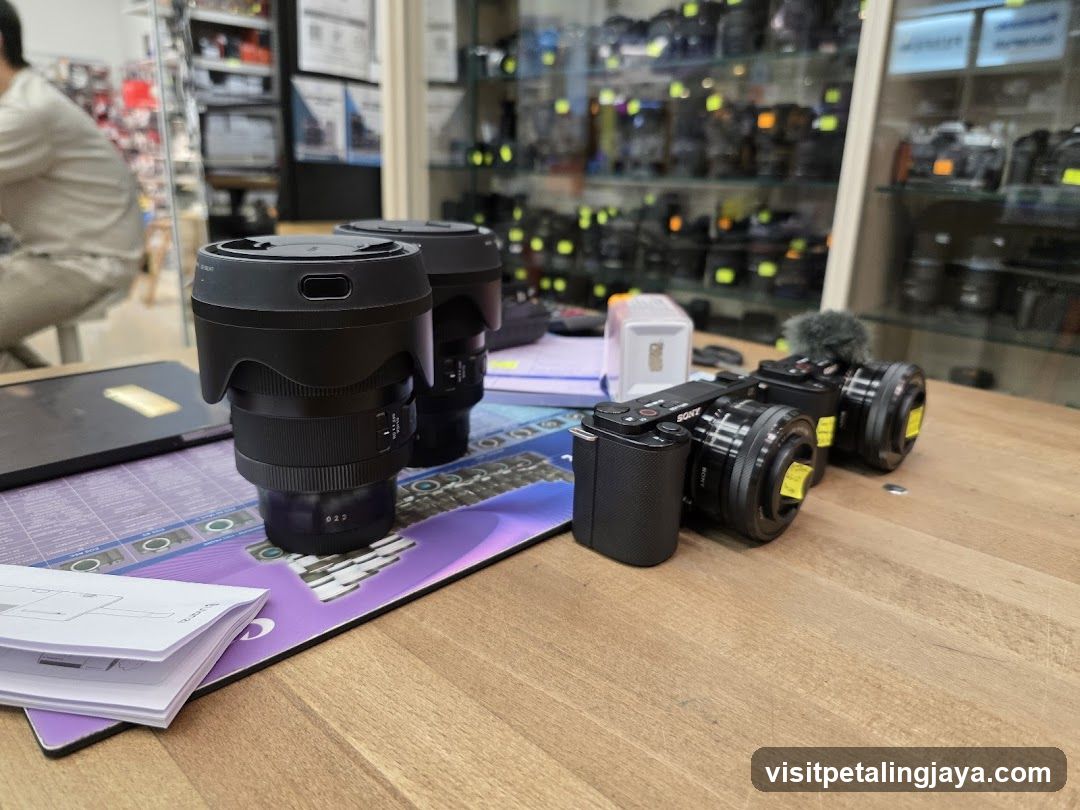 Camera lenses and cameras on display table