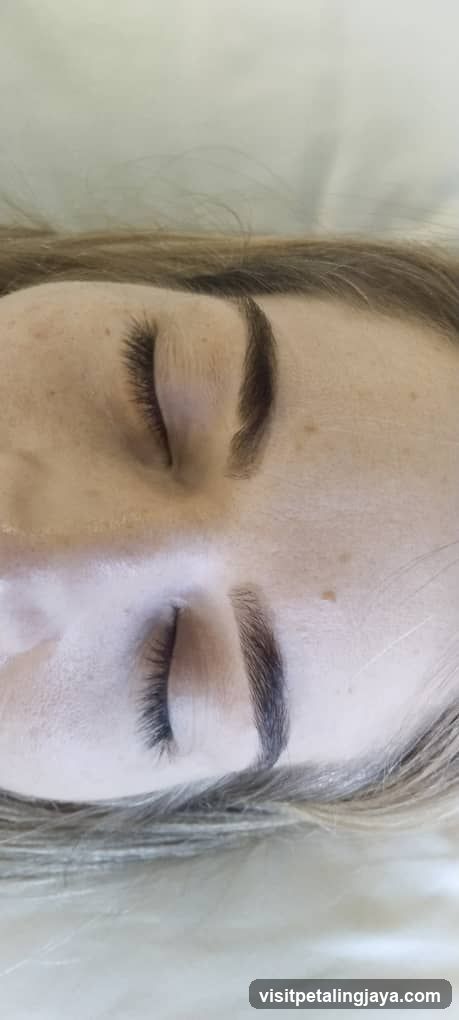 Close-up of a person's face with closed eyes