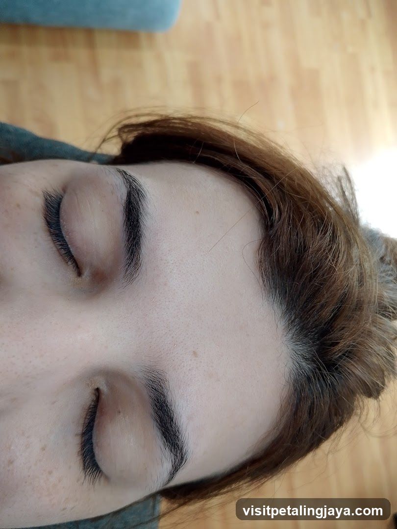 Close-up of a person's face with closed eyes