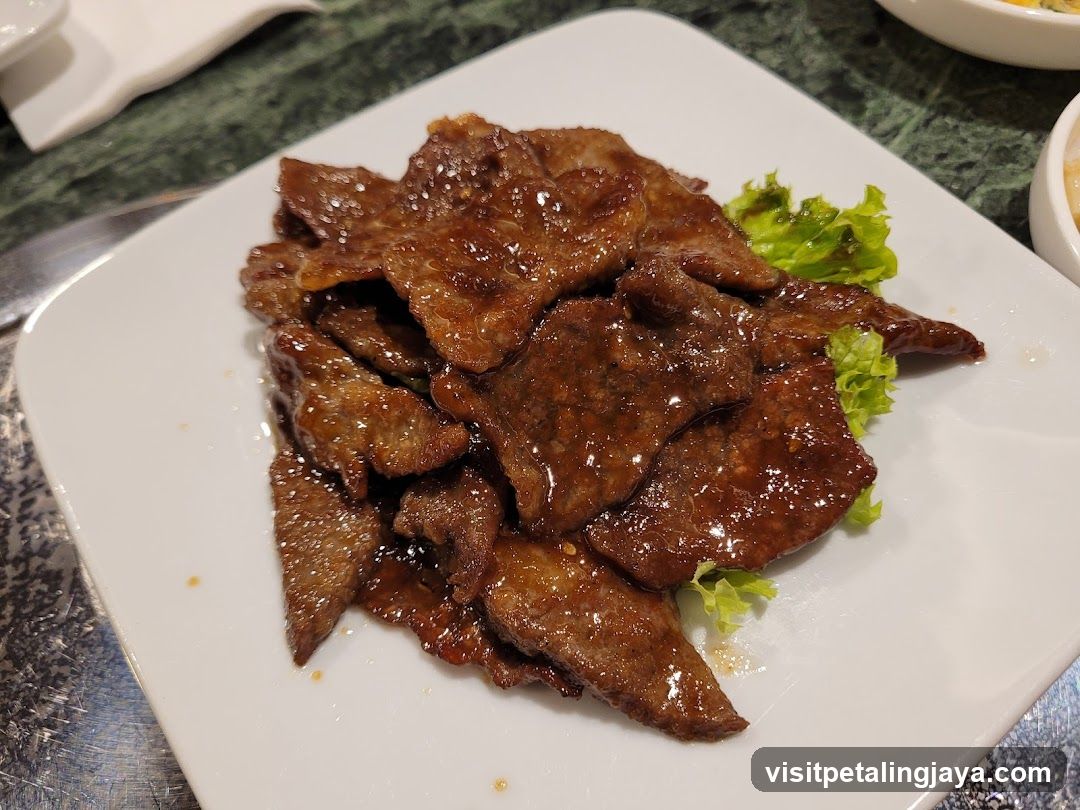 Sauced Beef Slices with Lettuce Garnish