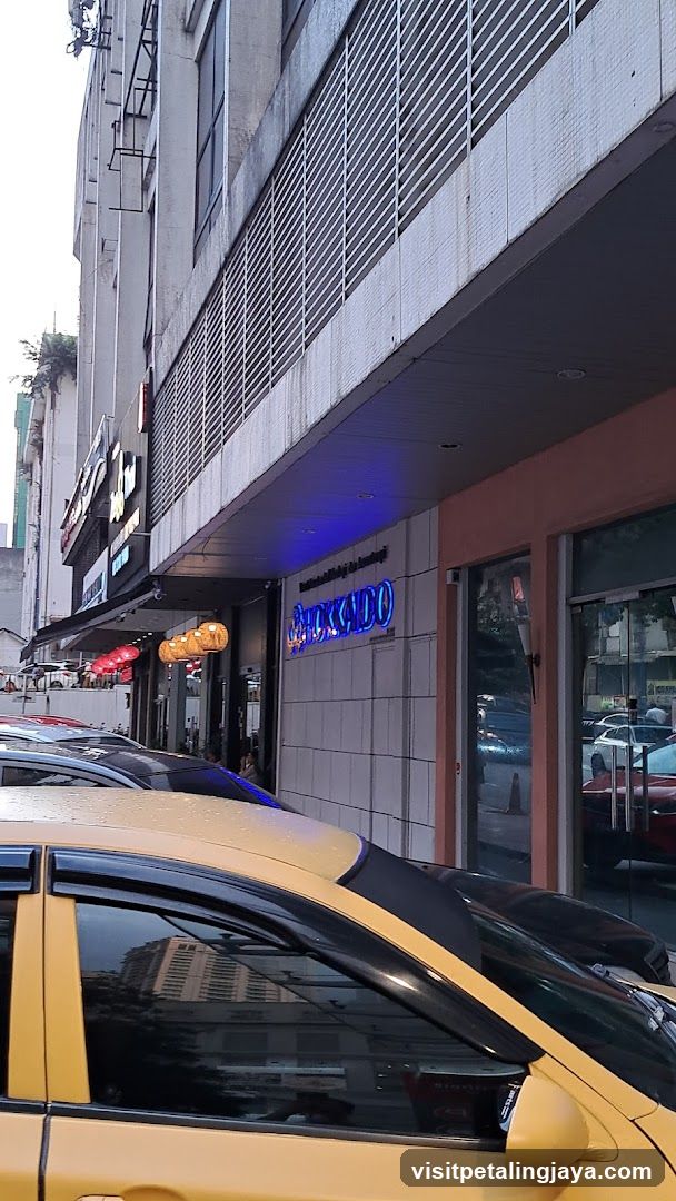 Street View with Yellow Taxi and Storefronts