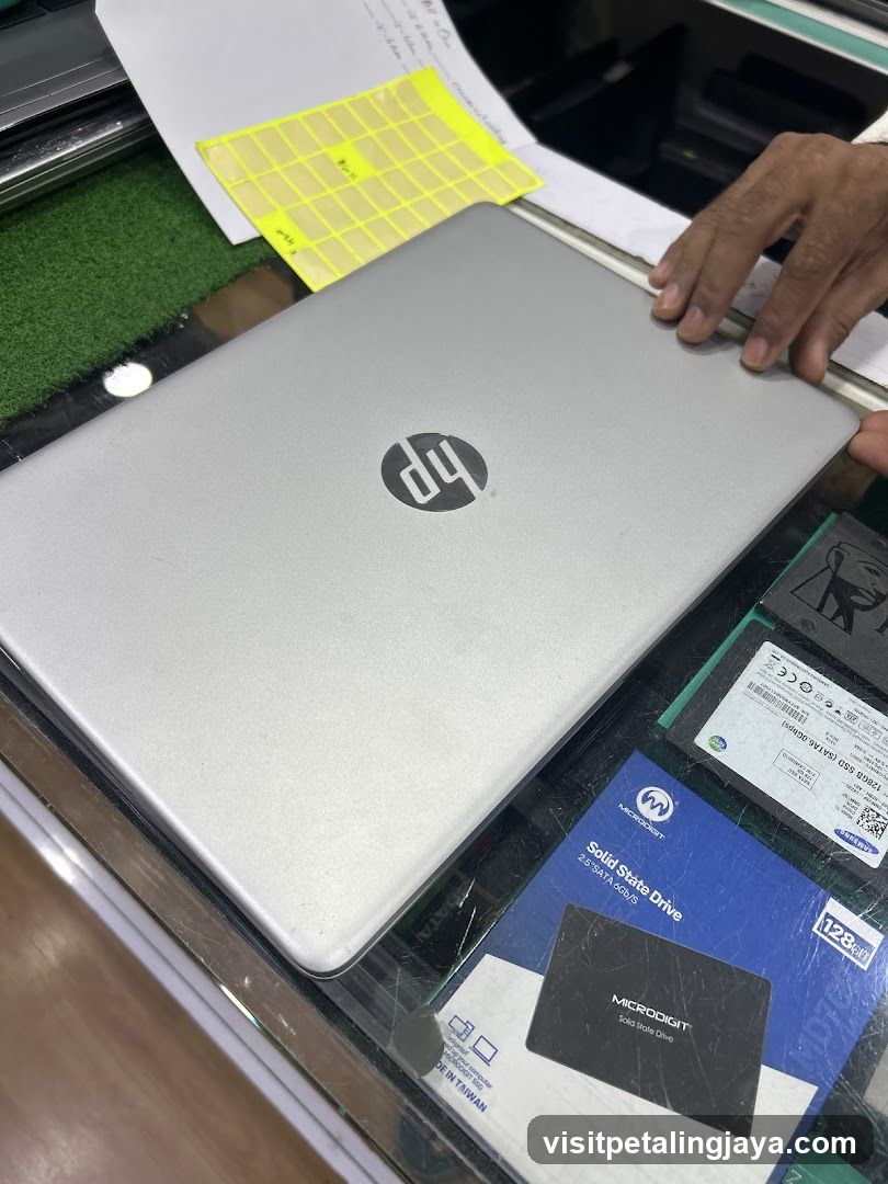 HP Laptop on Counter with Accessories