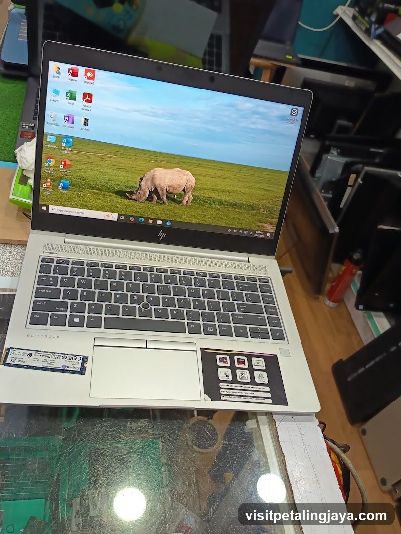 HP EliteBook Laptop on Glass Table