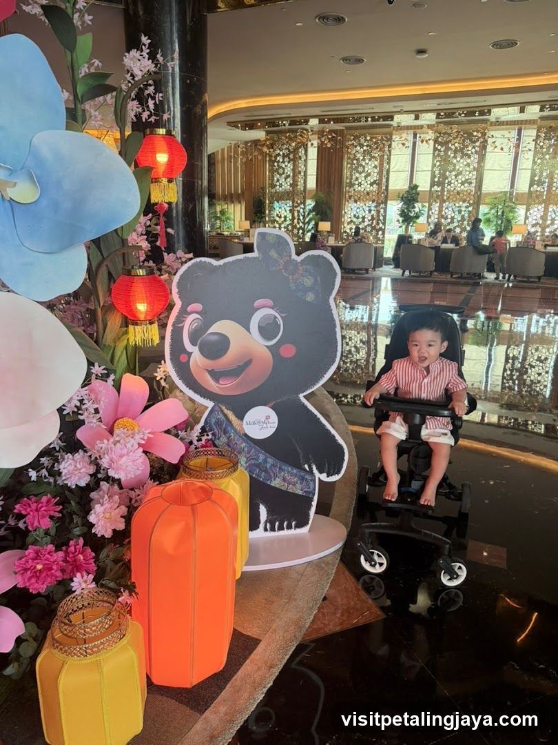 Child in Wheelchair at Hotel Lobby with Decorative Display