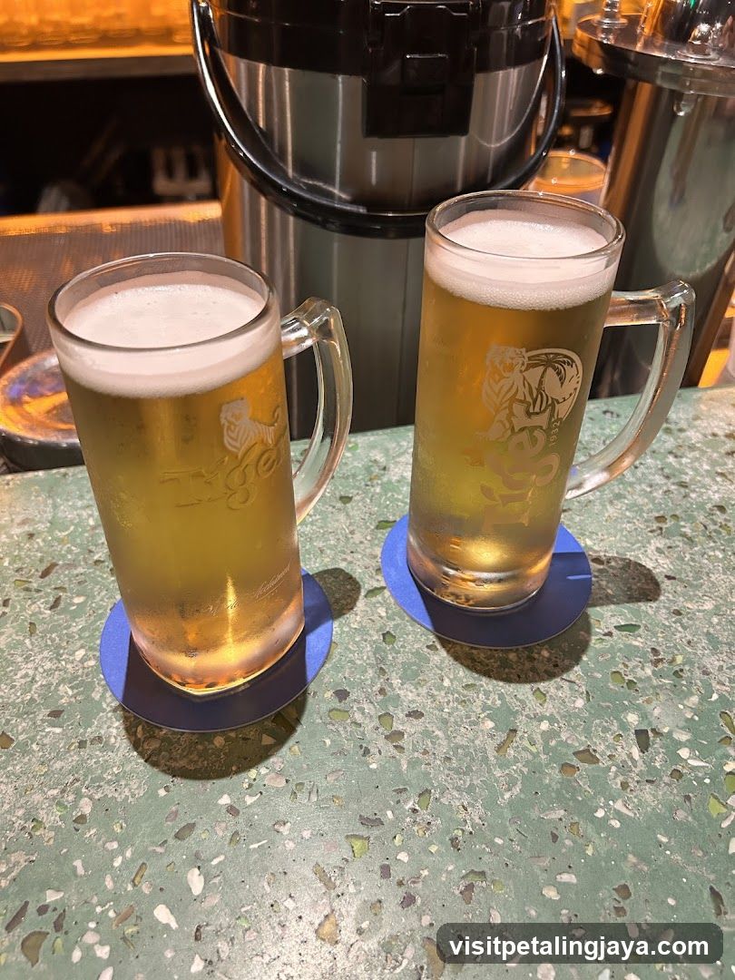 Two mugs of beer on a counter
