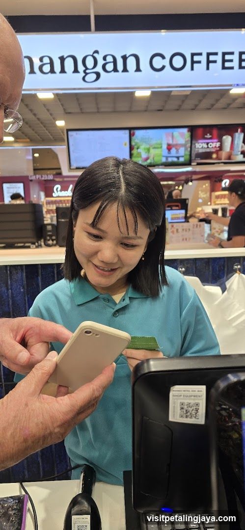 Customer at Coffee Shop Counter