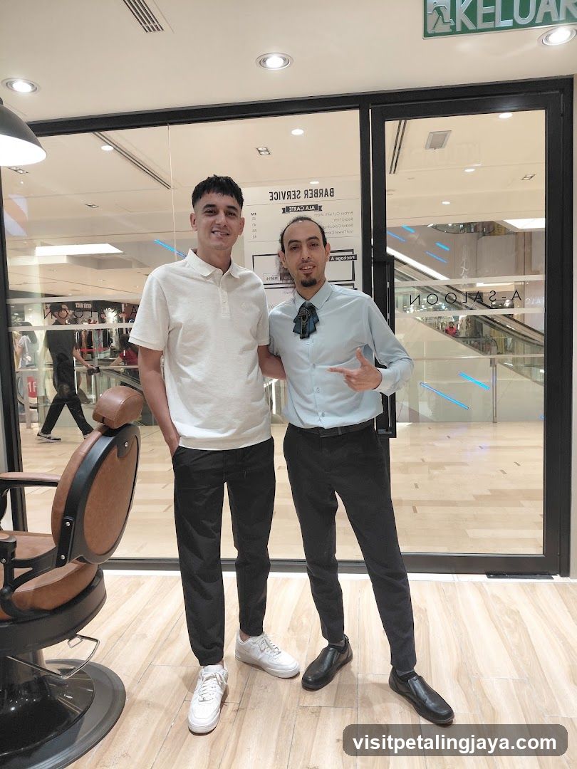 Barbershop Interior with Staff and Customer