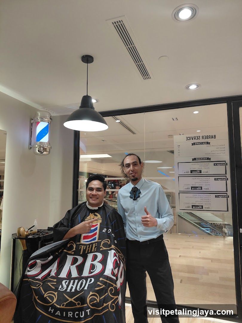 Barbershop Interior with Staff and Customer