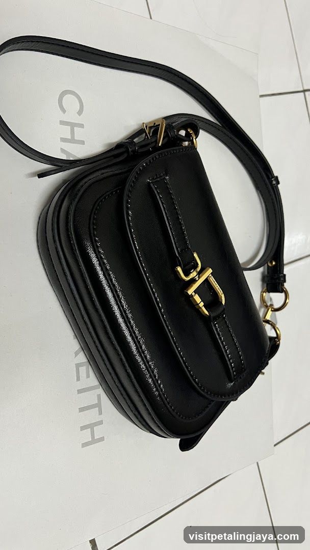 Black Leather Crossbody Bag on Brand Box