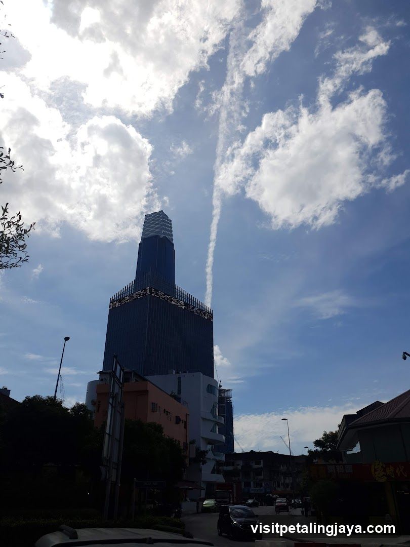 Tall Building with Clouds
