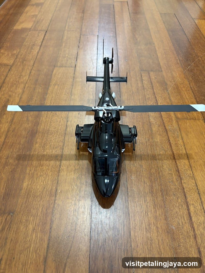 Black Helicopter Model on Wooden Floor