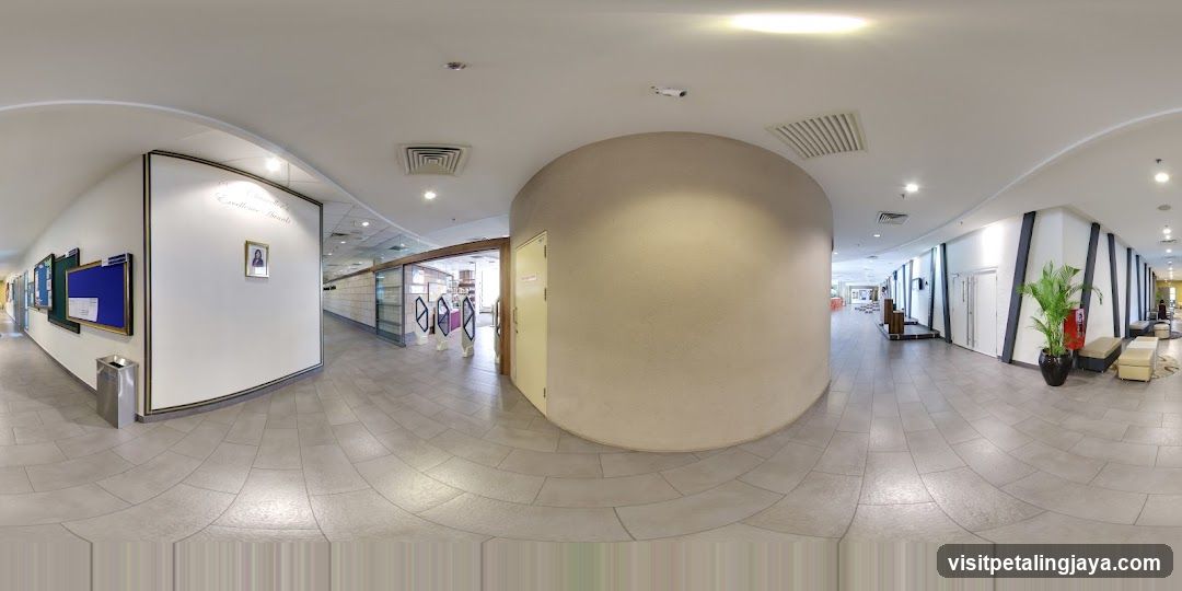 Interior Hallway with Bulletin Boards and Seating Area