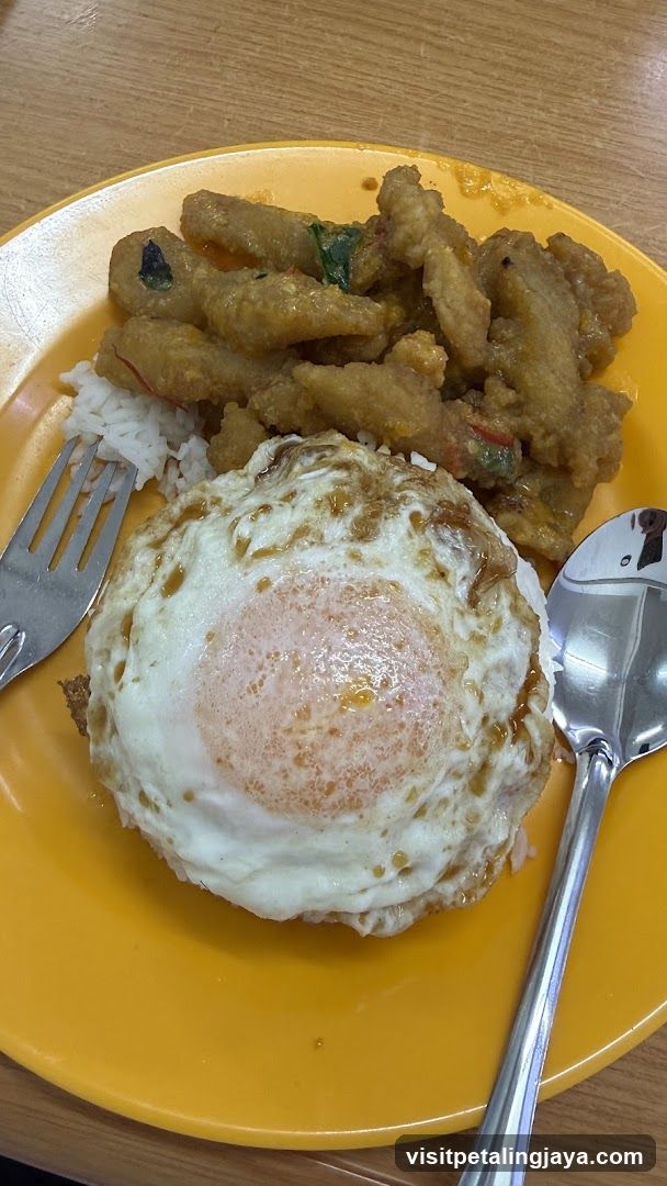 Fried Egg and Curry Dish on Yellow Plate