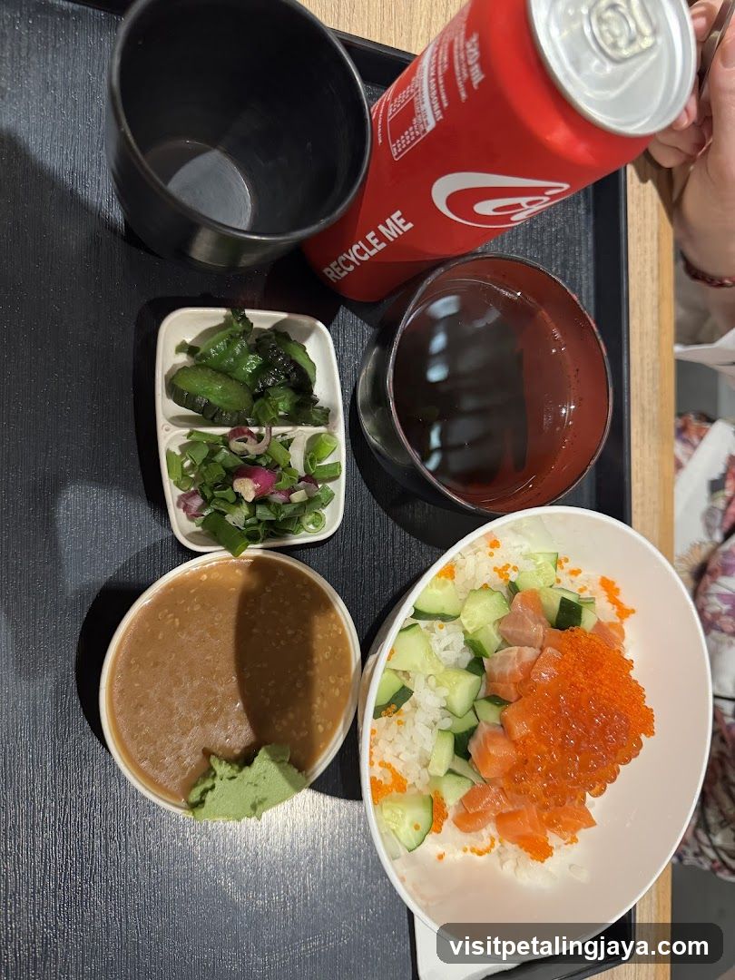 Bowl of Sushi Rice with Sashimi and Side Dishes