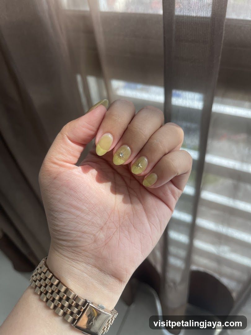 Hand with Yellow Nail Art