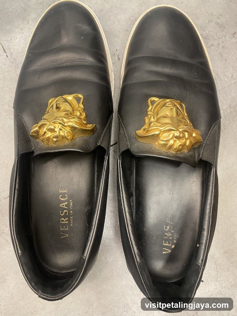 Versace Black Leather Loafers with Gold Medusa Embellishment