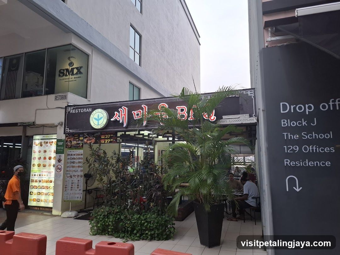 Restaurant Exterior with Staff and Plants