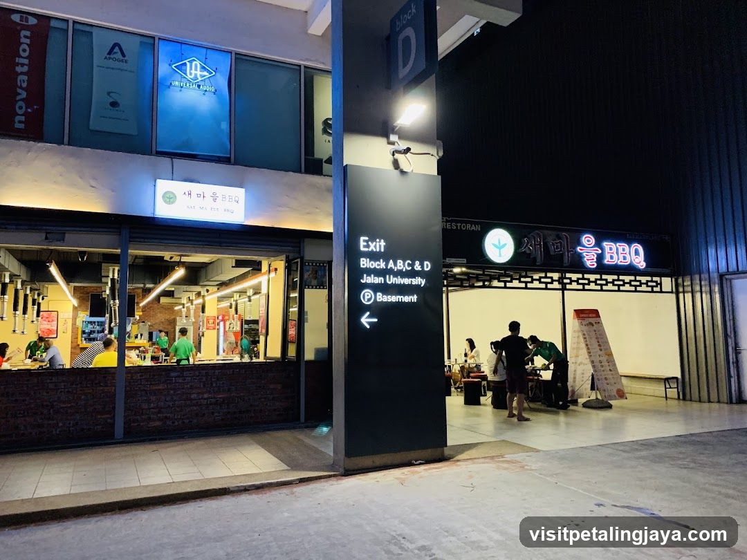 Nighttime Street View with Restaurant and Signage