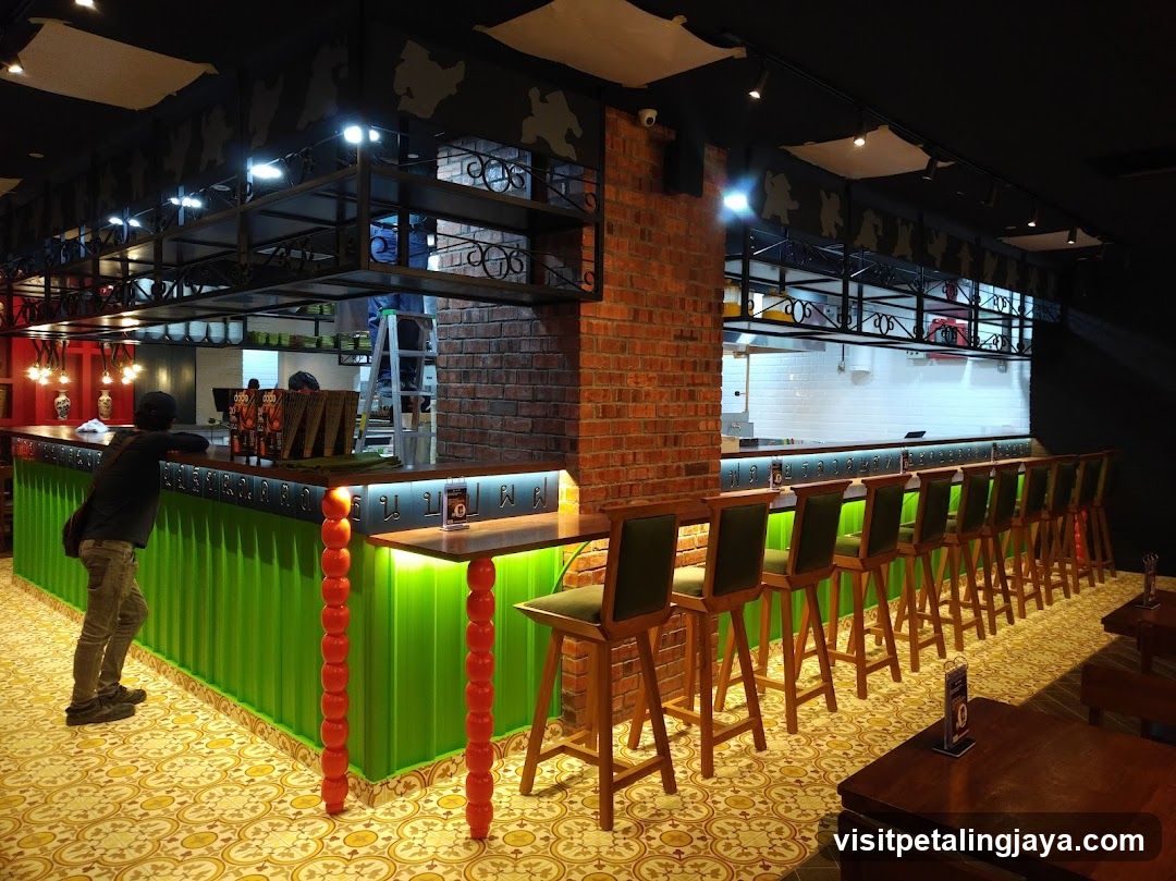 Bar Interior with Green Counter and Brick Column