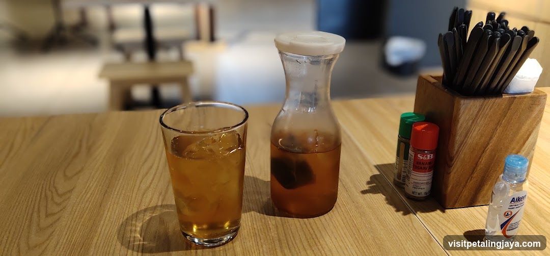 Beverage and condiments on a wooden table