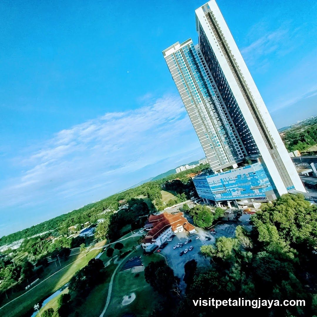 Aerial view of modern high-rise buildings and green landscape