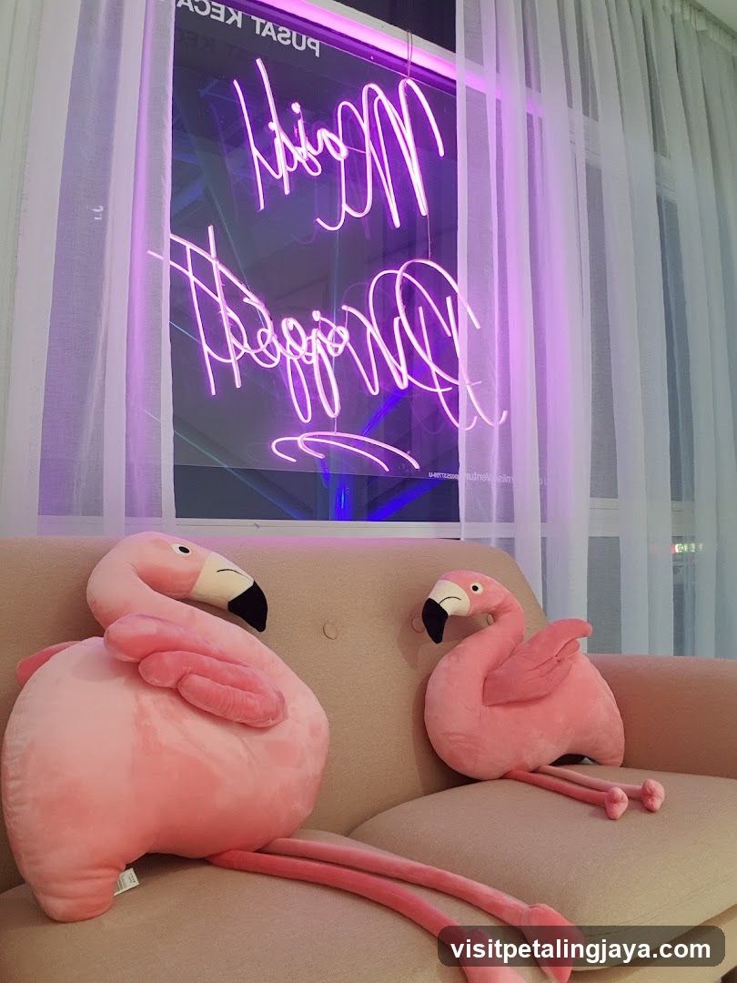 Flamingo plushies and neon sign