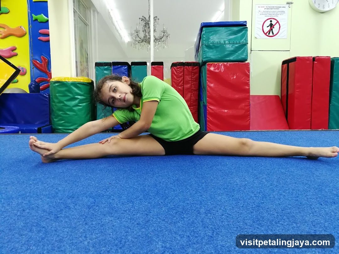 Girl doing splits in gym