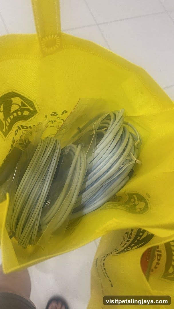 Yellow reusable bag with packaged items