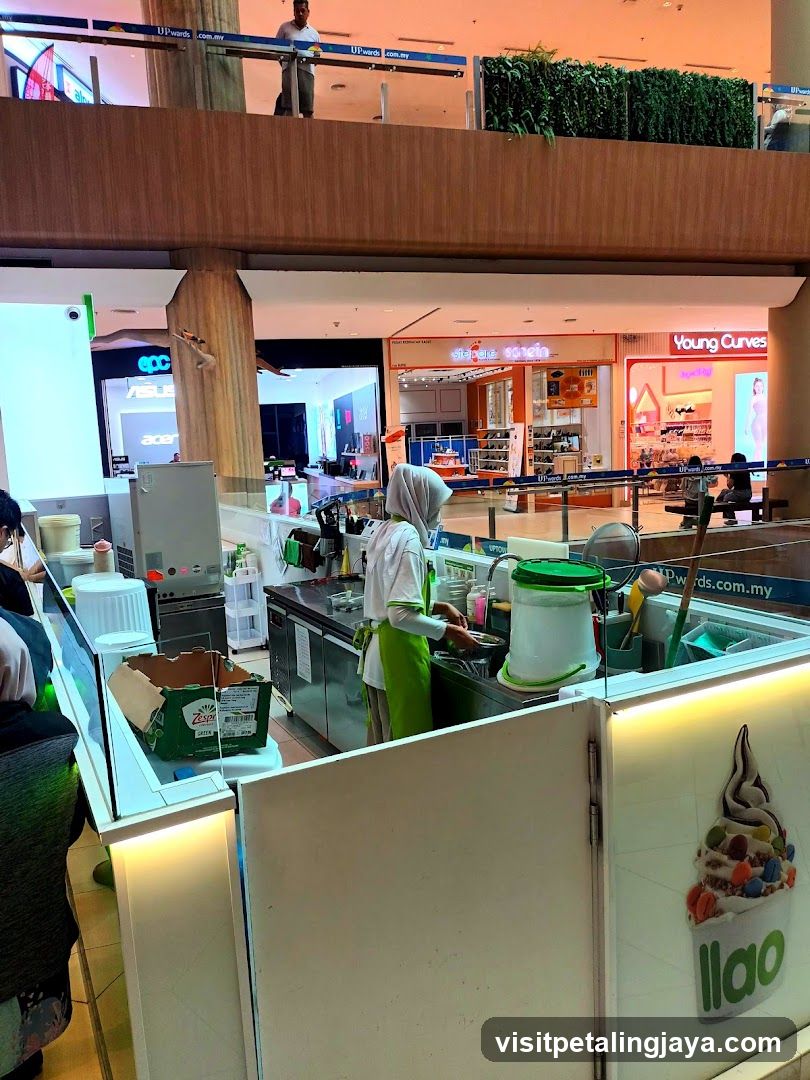 Food Stall Interior with Staff Preparing Food