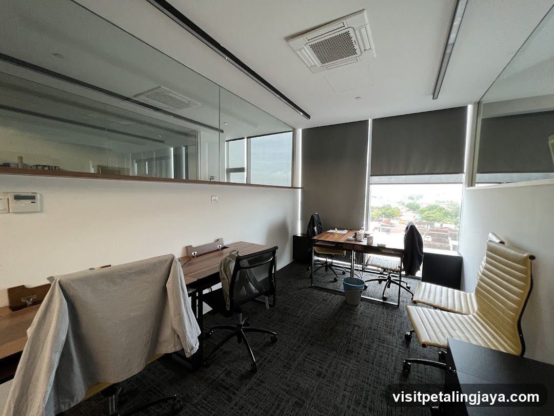 Office Interior with Glass Partition and Seating Area