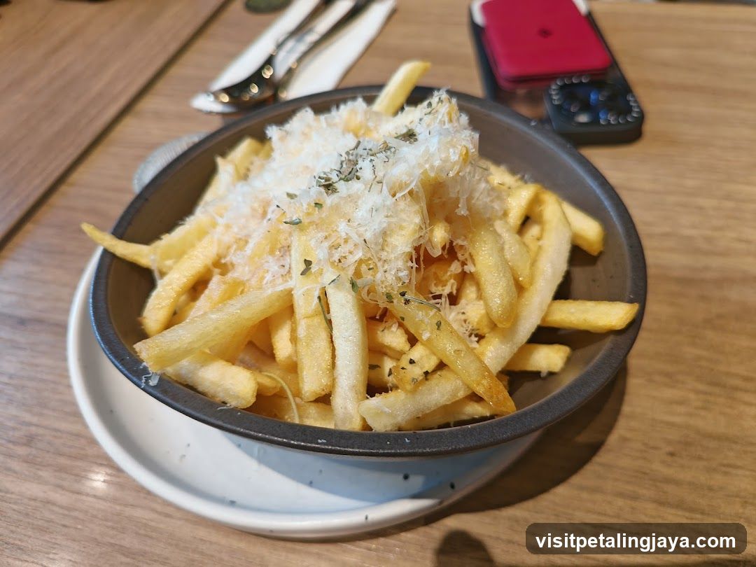 Bowl of Fries with Cheese and Herbs
