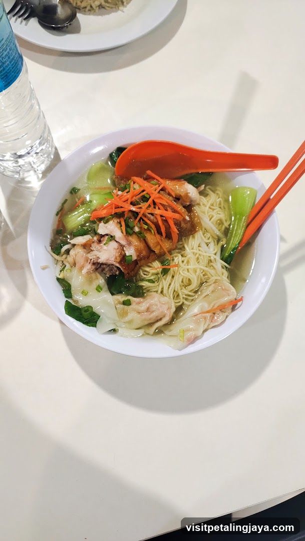 Bowl of Noodle Soup with Chicken and Vegetables