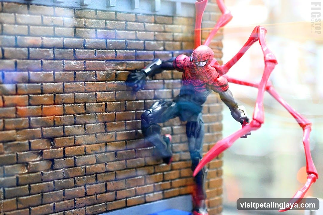 Spider-Man Action Figure on Brick Wall