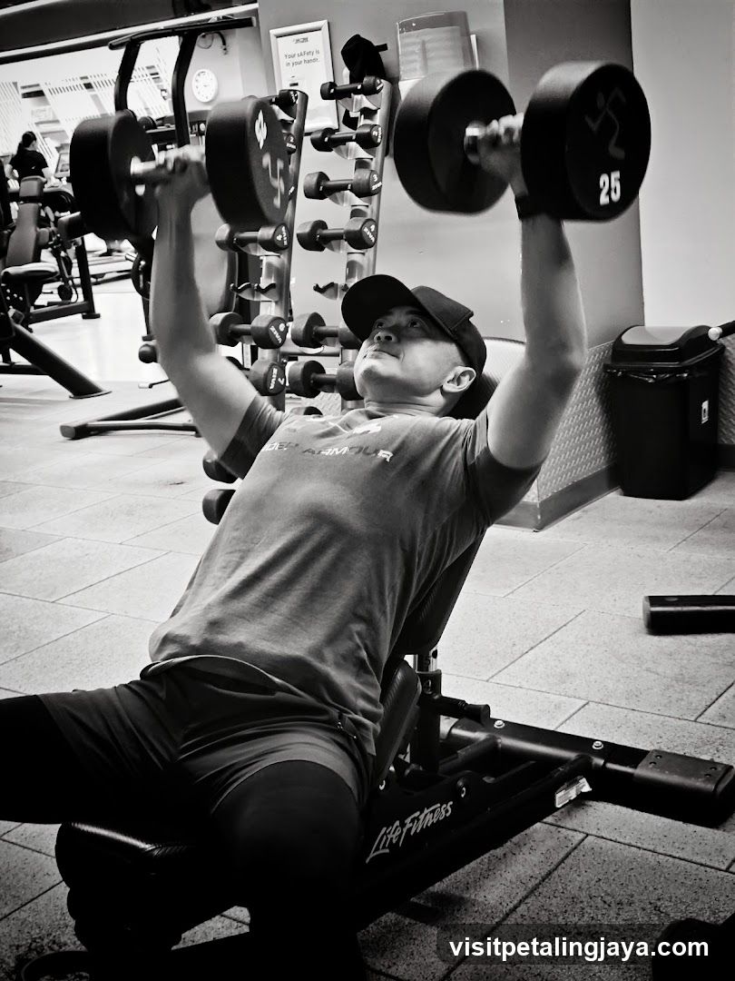 Gym Interior with Person Lifting Weights
