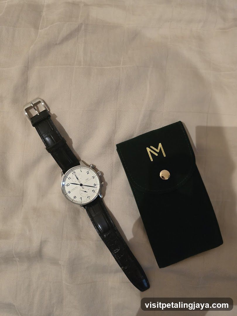 Watch and Pouch on Fabric Surface