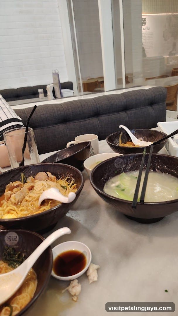 Dining Table with Bowls of Noodles and Soup