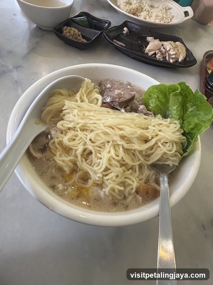 Bowl of Noodles with Broth and Side Dishes