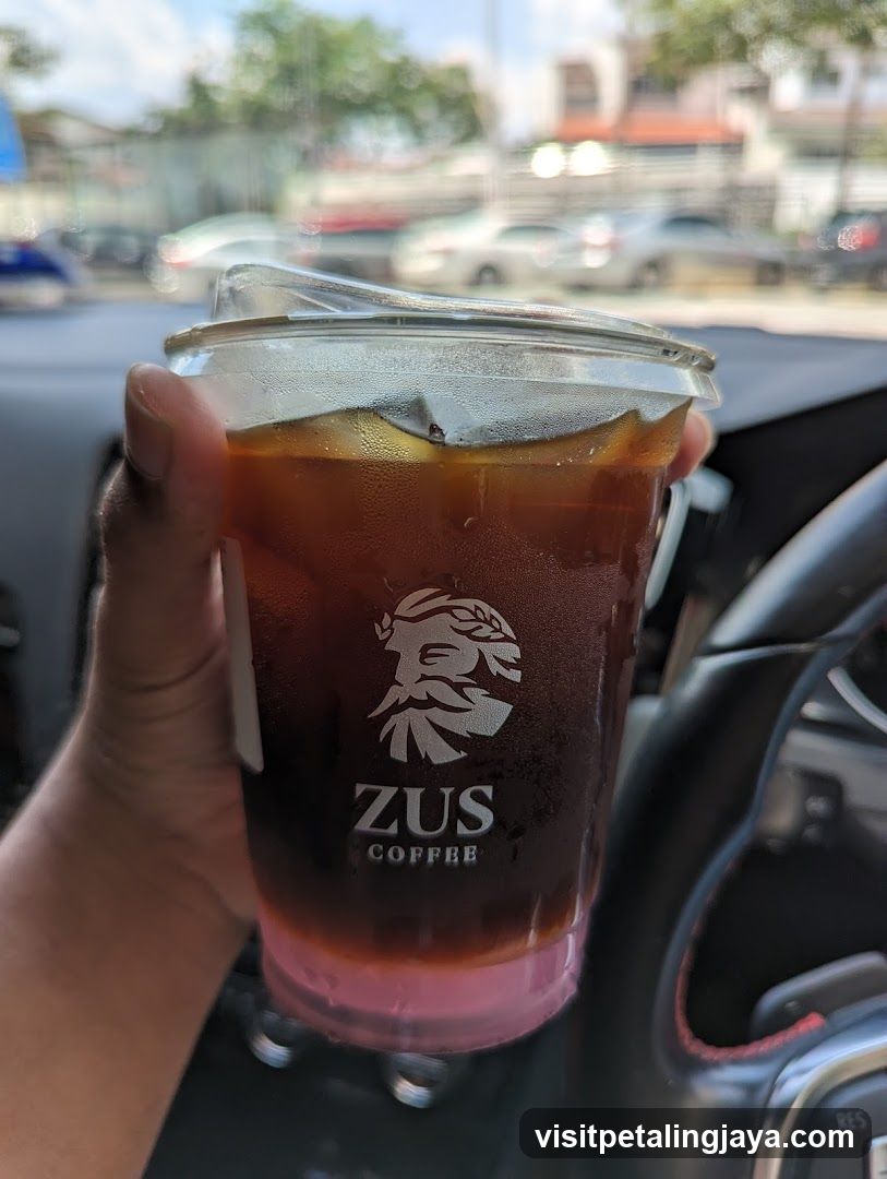 Zus Coffee Iced Drink in Car