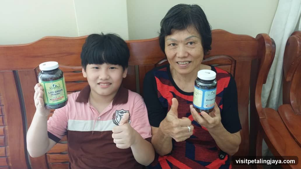Two people holding health supplement bottles
