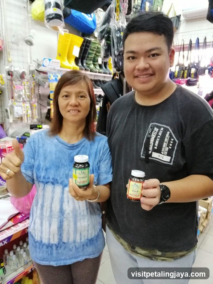 Two people holding bottles in a store