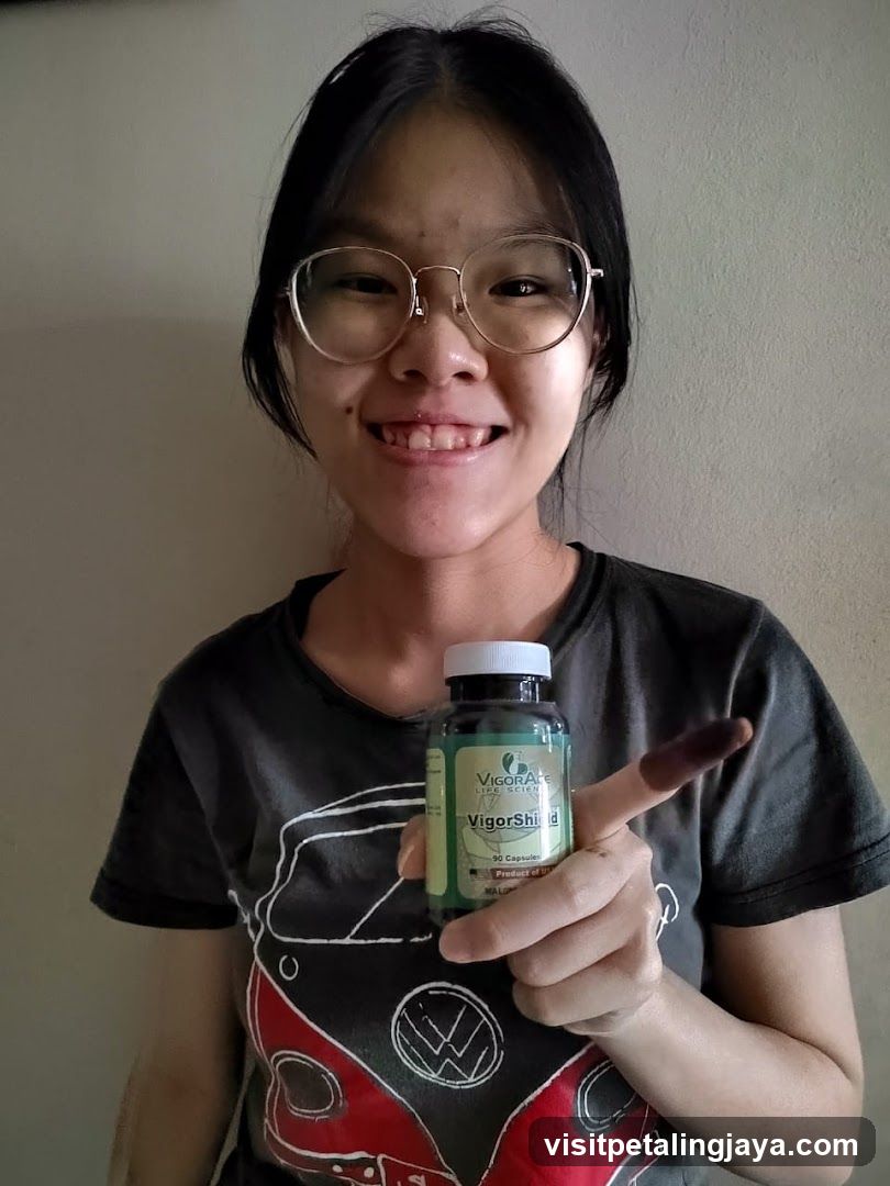 Person Holding Vitamin Bottle